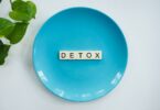 detox text on round blue plate